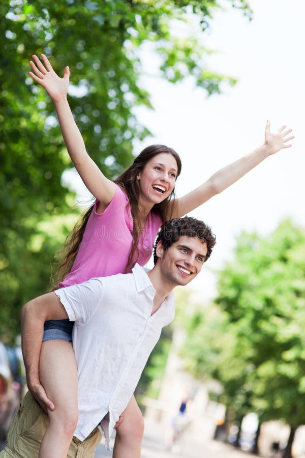 Man Giving Young Woman Piggyback Ride Smiling Side View High-Res Stock  Photo - Getty Images