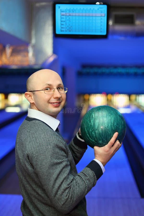 Man in Glasses Holds Ball for Bowling Stock Photo Image of club