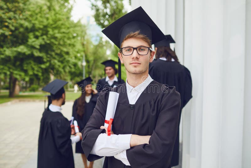 Man Graduate is Smiling Against the Background of University Graduates.  Stock Image - Image of people, diploma: 175140351