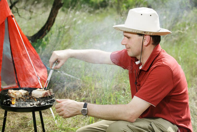 Man with grill stock image. Image of sitting, grilled 9803915