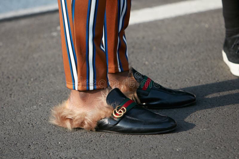 Man with Gucci slippers with fur and striped trousers before Dsquared 2 fashion show, Milan Fashion Week