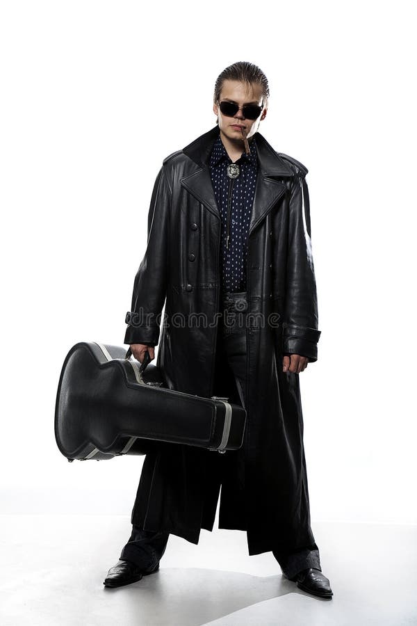 Man with guitar case