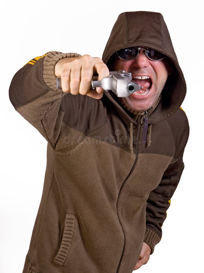 Man in a hood with gun stock photo. Image of handgun 16235354