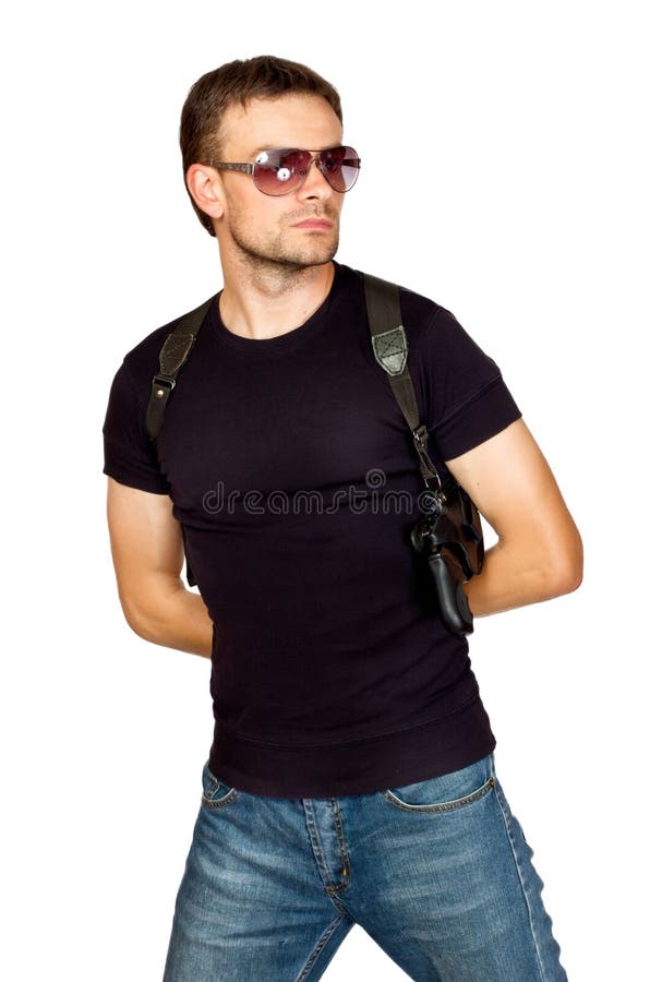 Man with a gun in the holster