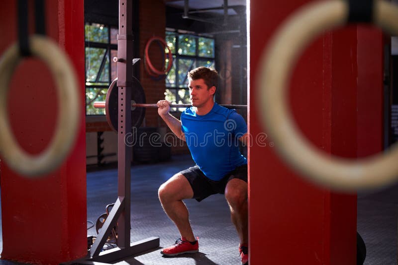 Man in Gym Clean and Jerk Lifting Weights Stock Photo Image of power