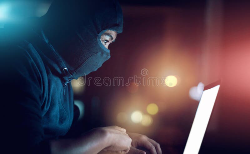 Man, hacker and laptop screen at night as thief with malware for hacking database software, hardware virus or firewall stock image