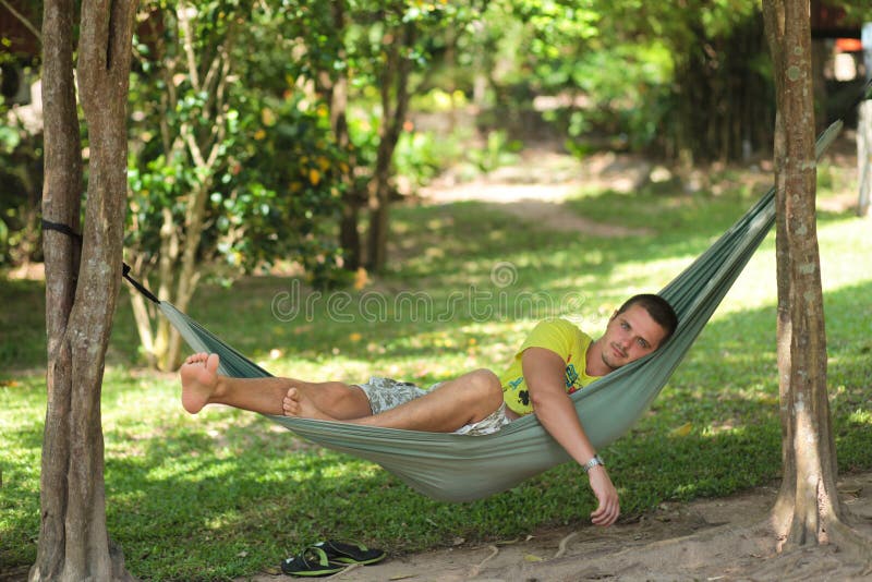 Man in a hammock stock image. Image of handsome, male 25603351