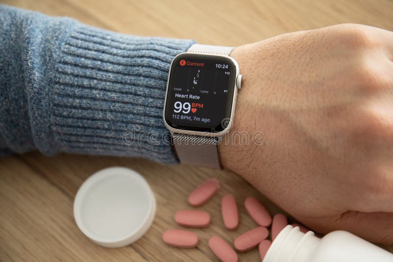 Man hand Apple Watch Series 4 with Heart Rate app royalty free stock photo Man hand Apple Watch Series 4 with Heart Rate app royalty free stock photo