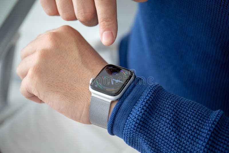 Alushta, Russia - November 3, 2018: Man hand with Apple Watch Series 4 in the home. Apple Watch was created and developed by the Apple inc.