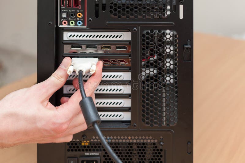 Man hand connecting the DVI cable for monitor to computer PC. royalty free stock image Man hand connecting the DVI cable for monitor to computer PC. royalty free stock image