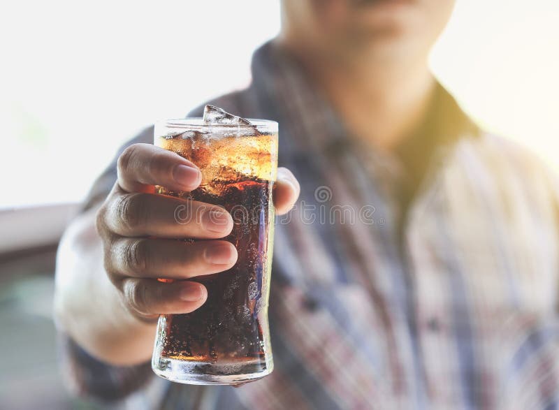 Man hand giving glass of cola