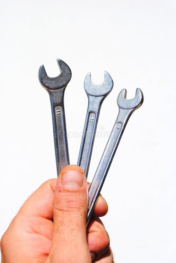 Man hand hold three wrench tool