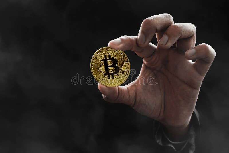 Man hand holding golden bitcoin royalty free stock photos