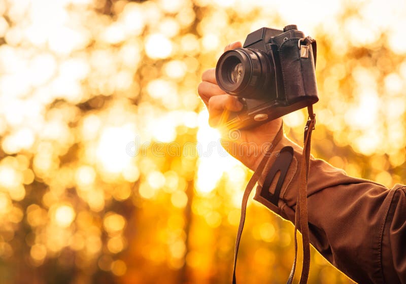 Man hand holding retro photo camera outdoor Lifestyle royalty free stock photos Man hand holding retro photo camera outdoor Lifestyle royalty free stock photos