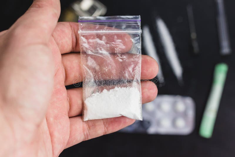 Man Hand Holds Plastic Packet or Bag with Cocaine or Another Drugs ...