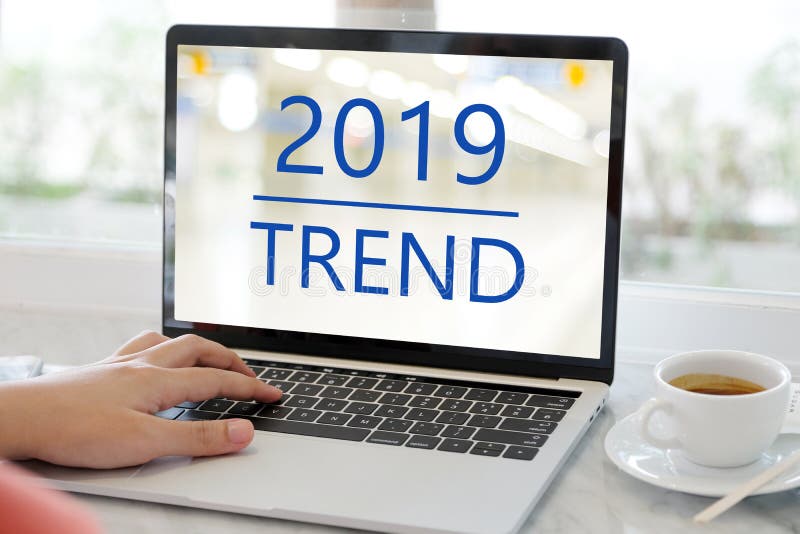Man hand using laptop computer with 2019 trends on screen background, digital marketing, business and technology concept royalty free stock photography Man hand using laptop computer with 2019 trends on screen background, digital marketing, business and technology concept royalty free stock photography