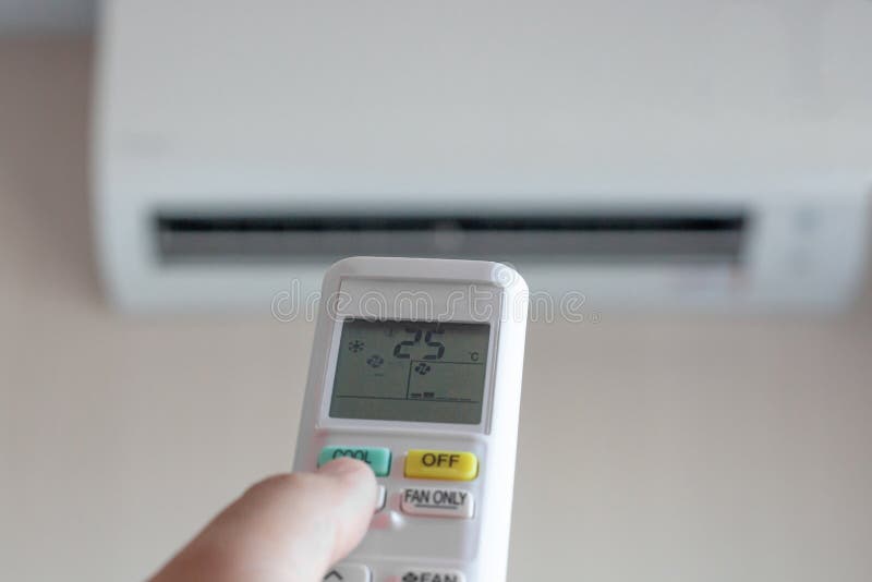 Man hand using remote control open The air conditioner is cool to 25 degrees royalty free stock images Man hand using remote control open The air conditioner is cool to 25 degrees royalty free stock images