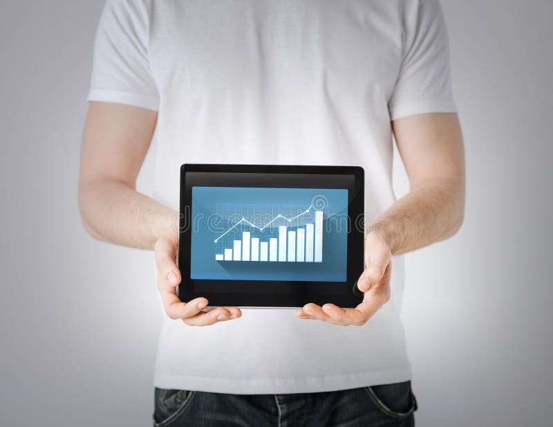 Business and finance - man hands holding tablet pc with graph