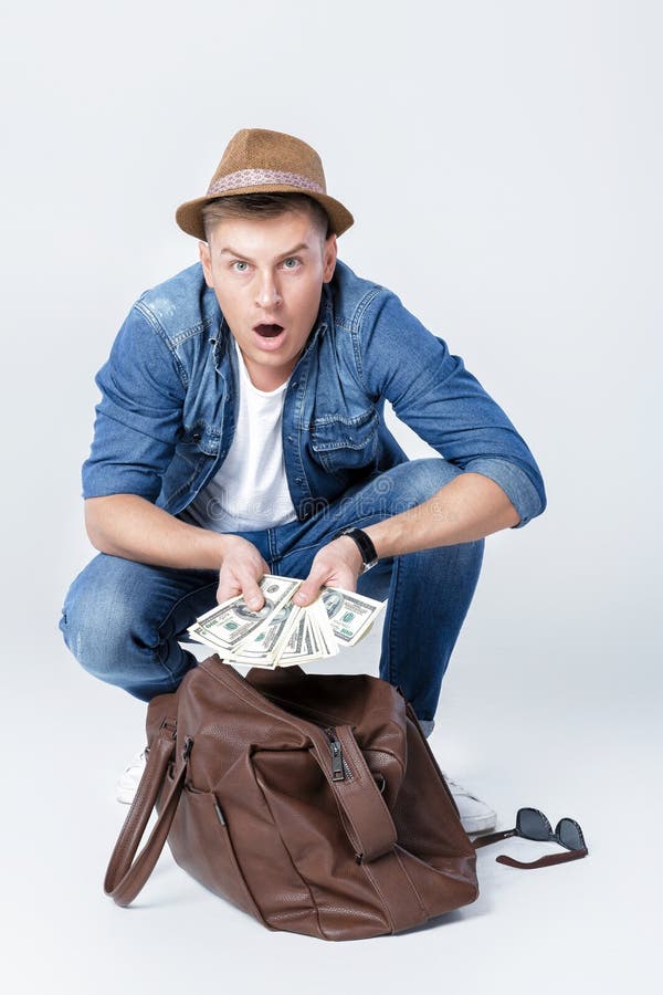 Man In A Hat Found Money In A Leather Bag Stock Photo Image of