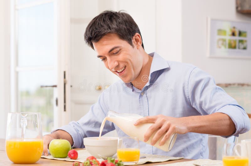 Man Having Breakfast With Milk