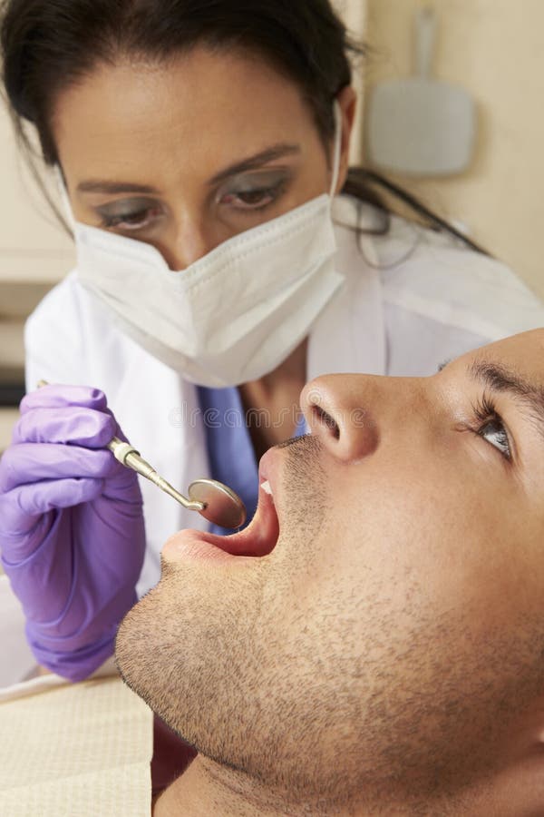 Man Having Check Up At Dentists Surgery stock photography Man Having Check Up At Dentists Surgery stock photography