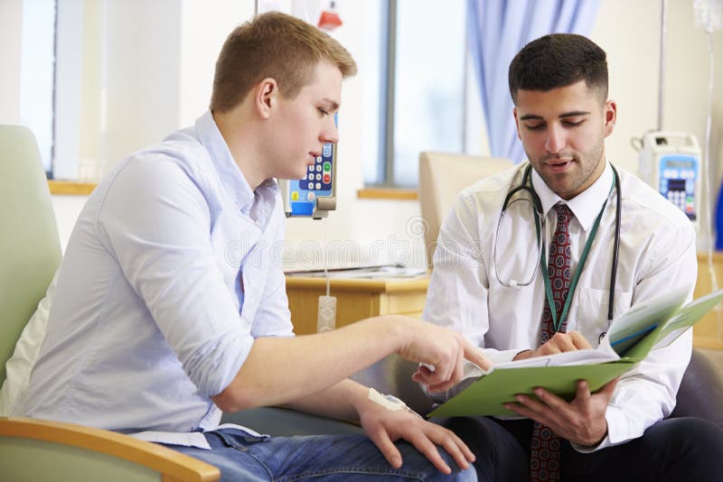 Man Having Chemotherapy Looking At Test Results With Doctor stock images Man Having Chemotherapy Looking At Test Results With Doctor stock images
