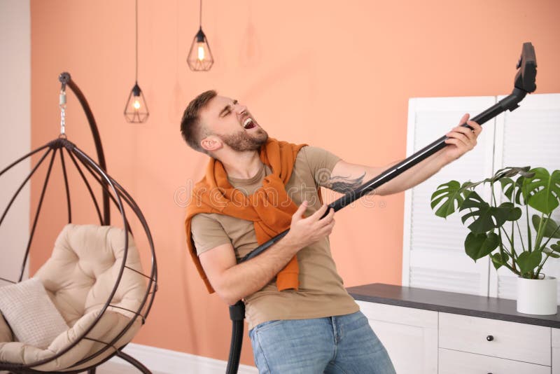 Young Man Having Fun while Vacuuming at Home Stock Image Image of