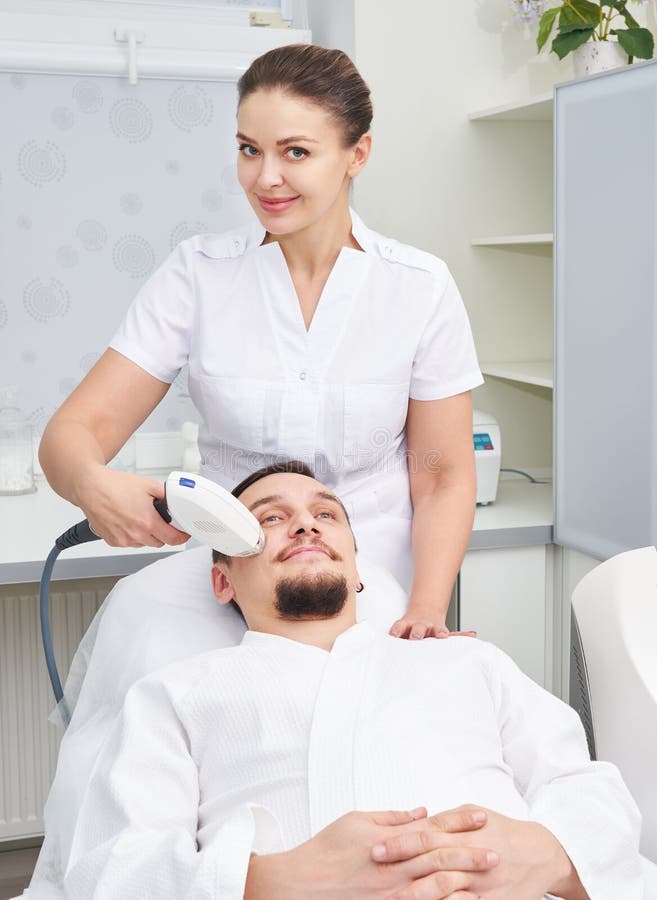 Man Having Laser Treatment At Beauty Clinic Stock Photo Image Of