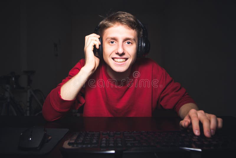 Gamer using controller to play online video games on computer. Man playing  game with joystick and headphones in front of monitor. Player having gaming  equipment, doing fun activity Stock Photo - Alamy