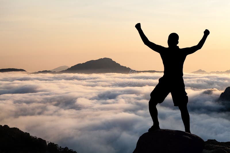 Man hiking climbing silhouette in mountains