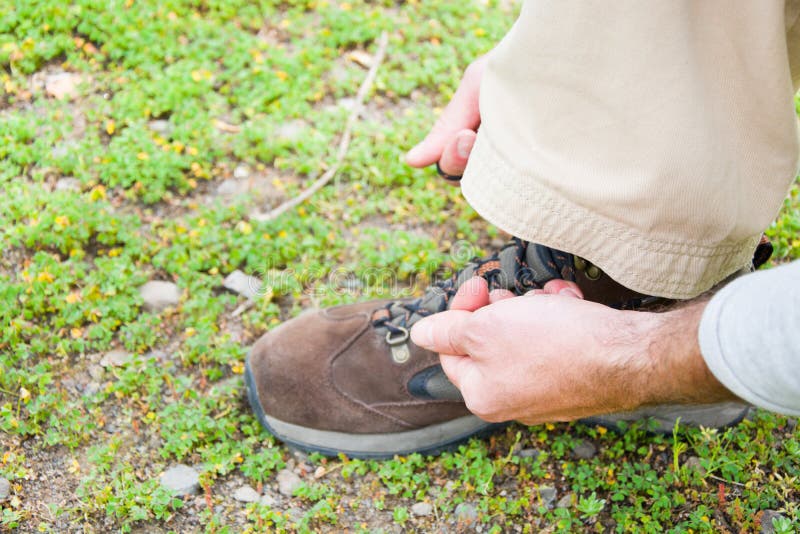 Man Hiking Doing the Knot Shoes Stock Image Image of standing, tying