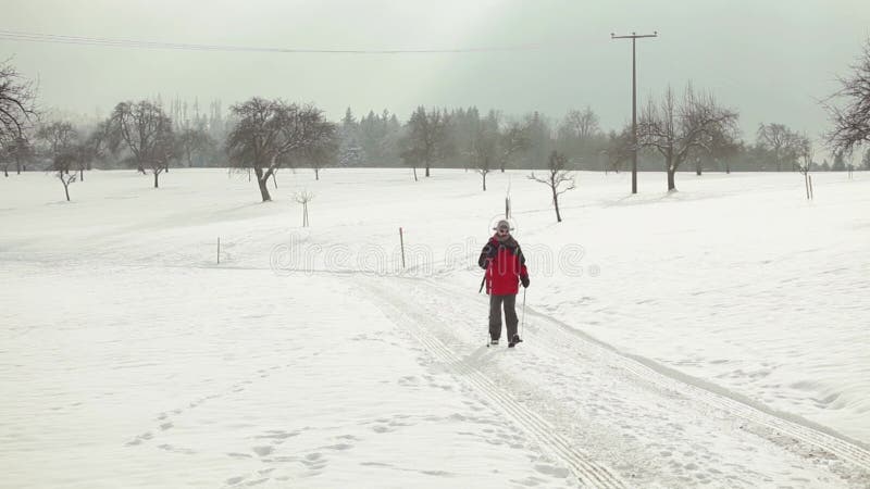 Man hiking outdoors at snow at sunny day