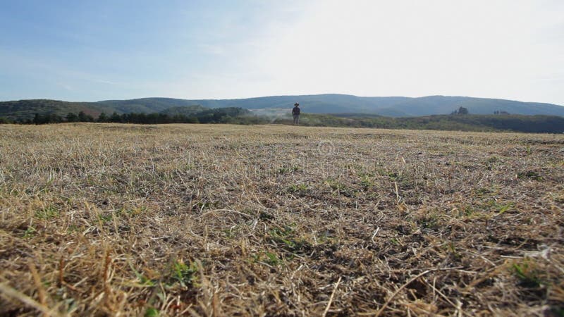 Man hiking outdoors on sunny day