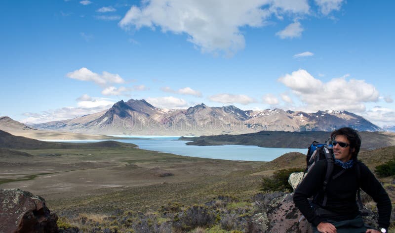 Man hiking rest stop by lake