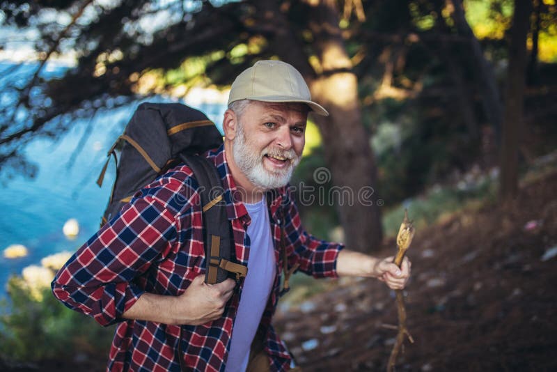 Man, hiking by the sea and exploring the nature royalty free stock photography