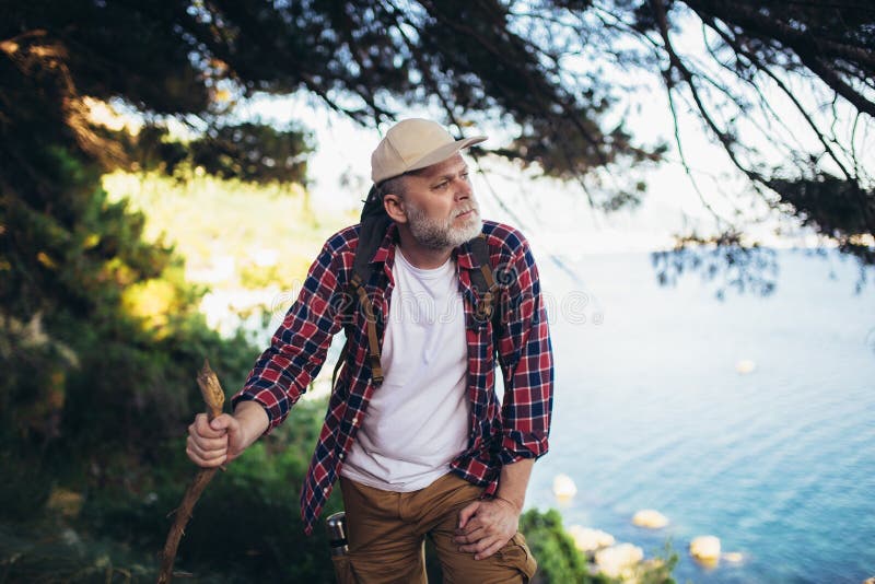 Man, hiking by the sea and exploring the nature royalty free stock photo