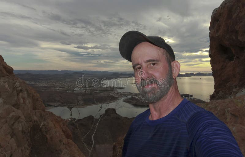 A Man Hiking Takes a Selfie on Tetakawi Mountain Above Los Algodones
