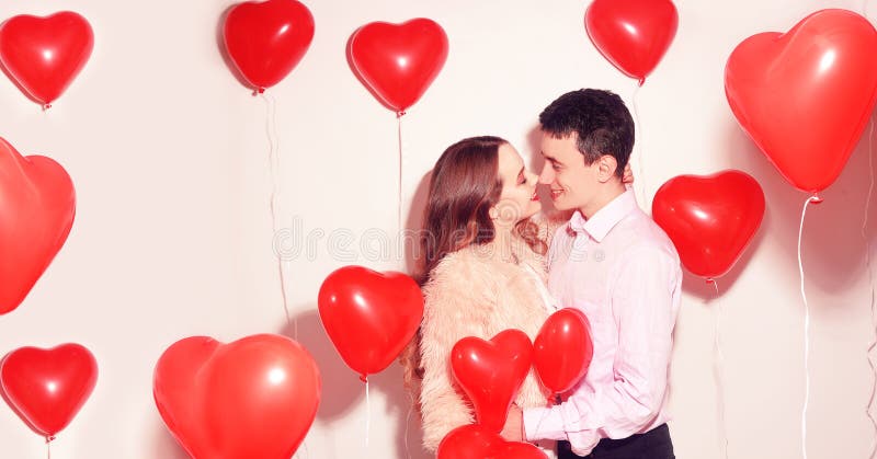 Man with his lovely sweetheart girl kiss at Lover`s valentine day. Valentine Couple. Couple kiss and hug.