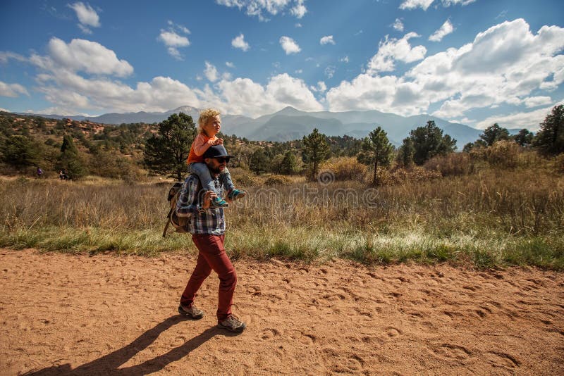 A man with his son are hiking in mountains stock photography A man with his son are hiking in mountains stock photography