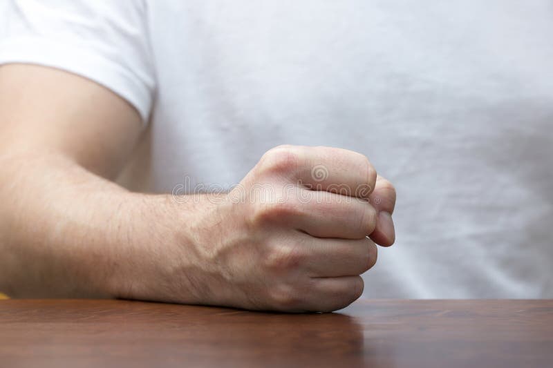 Man is hitting fist on the table. stock image Man is hitting fist on the table. stock image