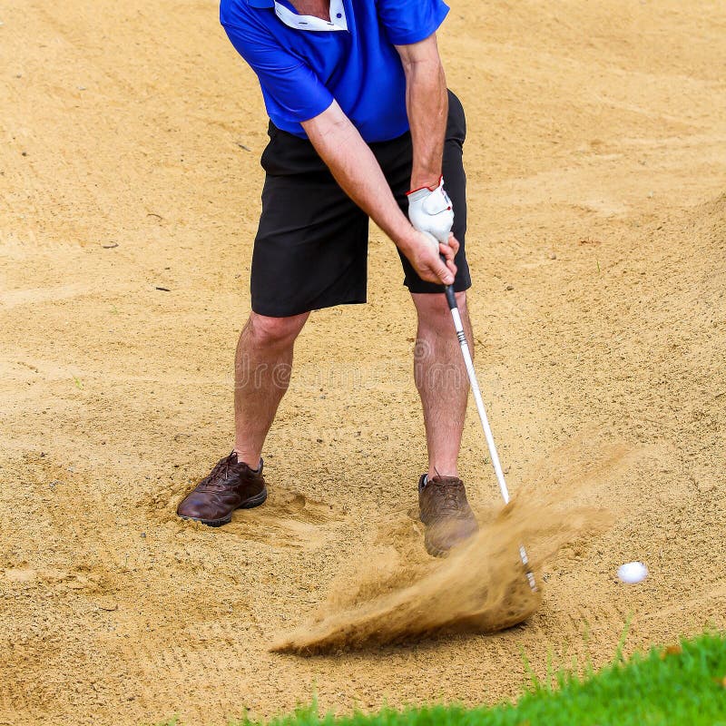 Man hitting golf ball out of a bunker stock images Man hitting golf ball out of a bunker stock images