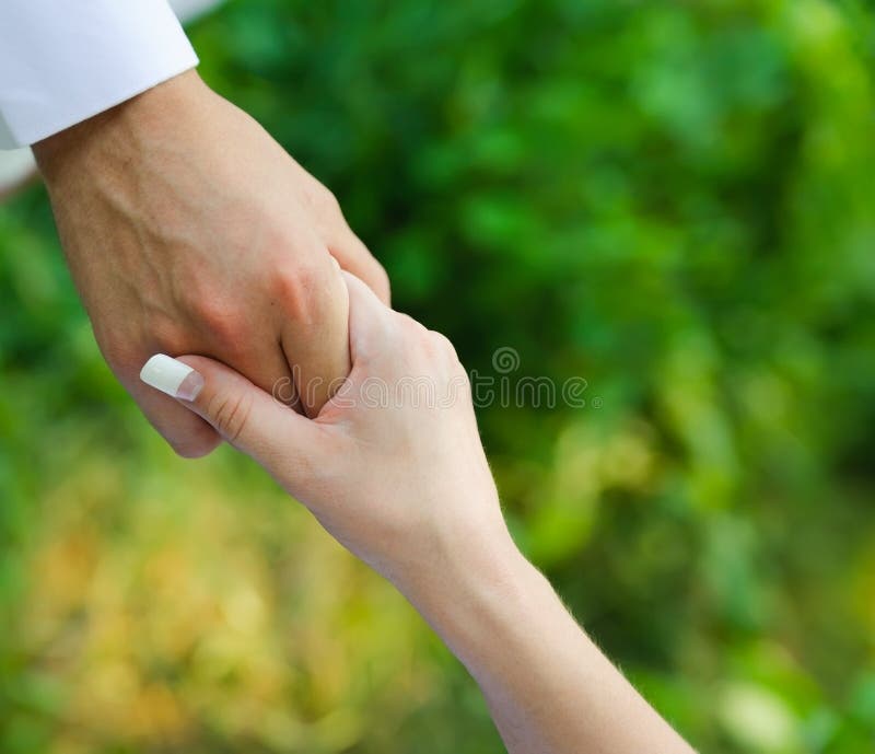 Man Hold a Woman Fingers by the Hand Stock Image Image of assistance, human 27038991