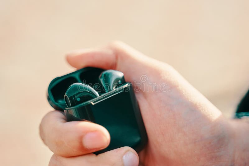 Man holding airpods