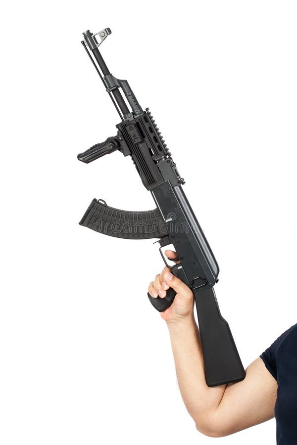 Man holding AK-47 machine gun isolated on white