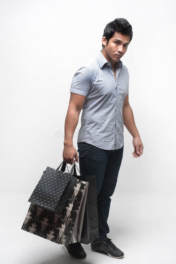 Man holding bags stock photo. Image of culture, glee 24016828