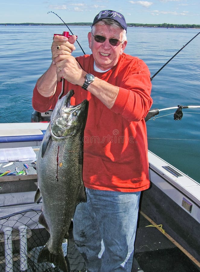 Man Holding Big Lake Ontario King Salmon Fish