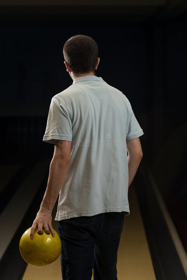 Man Holding a Bowling Ball stock photo. Image of sports 36731420