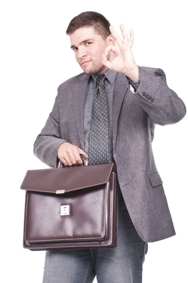 Man holding a briefcase and making ok sign