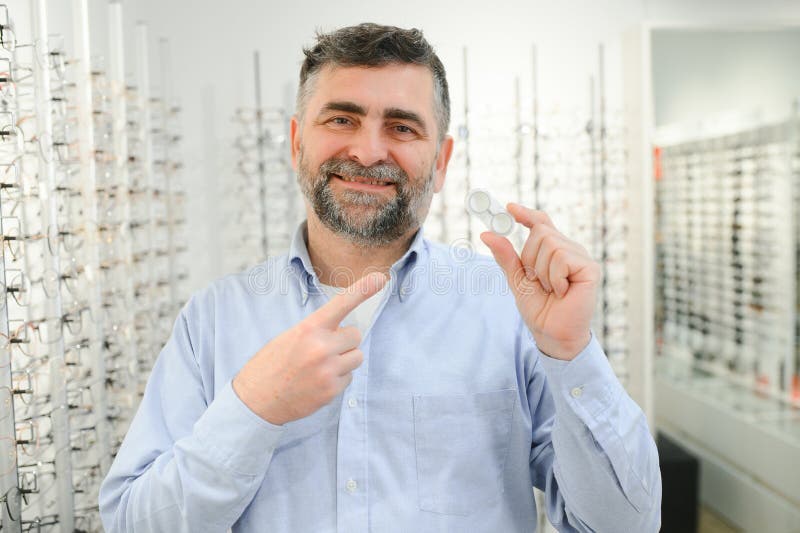 Man Holding Contact Eye Lenses and Container in Hand, Applying Eye ...