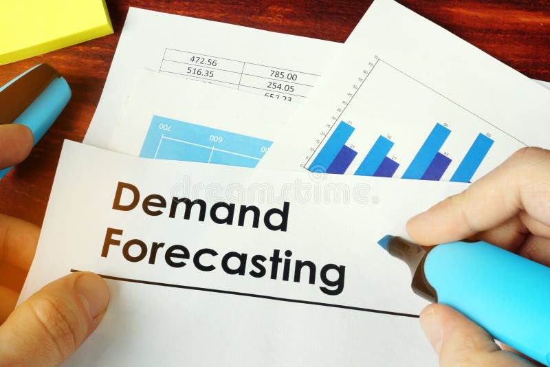 Man holding documents with Demand Forecasting.